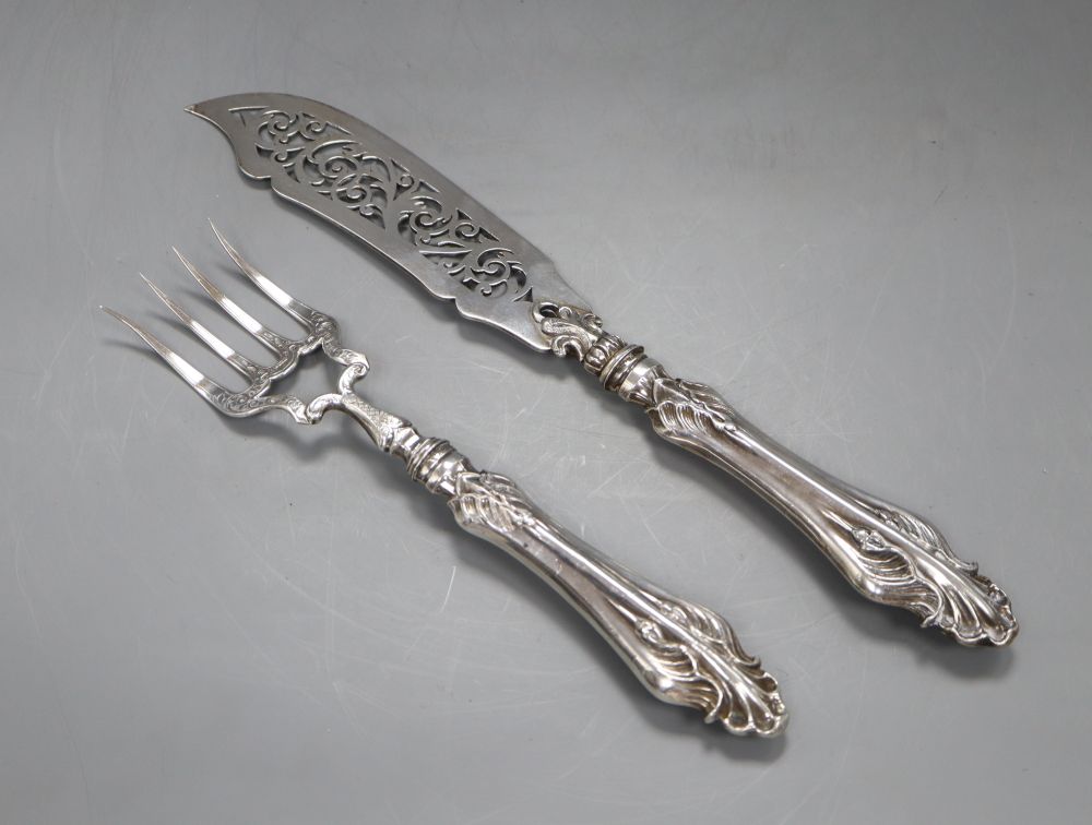 An ornate pair of Victorian pierced silver fish servers, Hilliard & Thomason, Birmingham, 1859, knife 31cm.